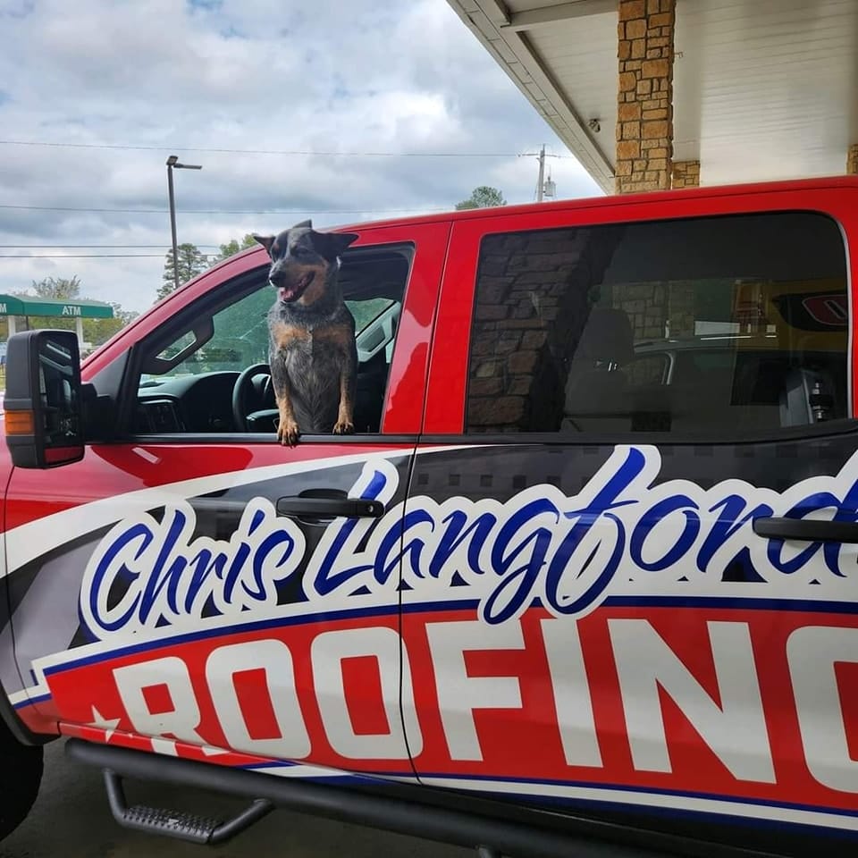 Langford Roofing truck with company mascot